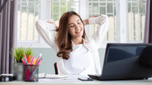 Woman looking confidently relaxed at her work desk