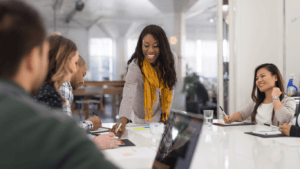 african american woman leading a roundtable meeting