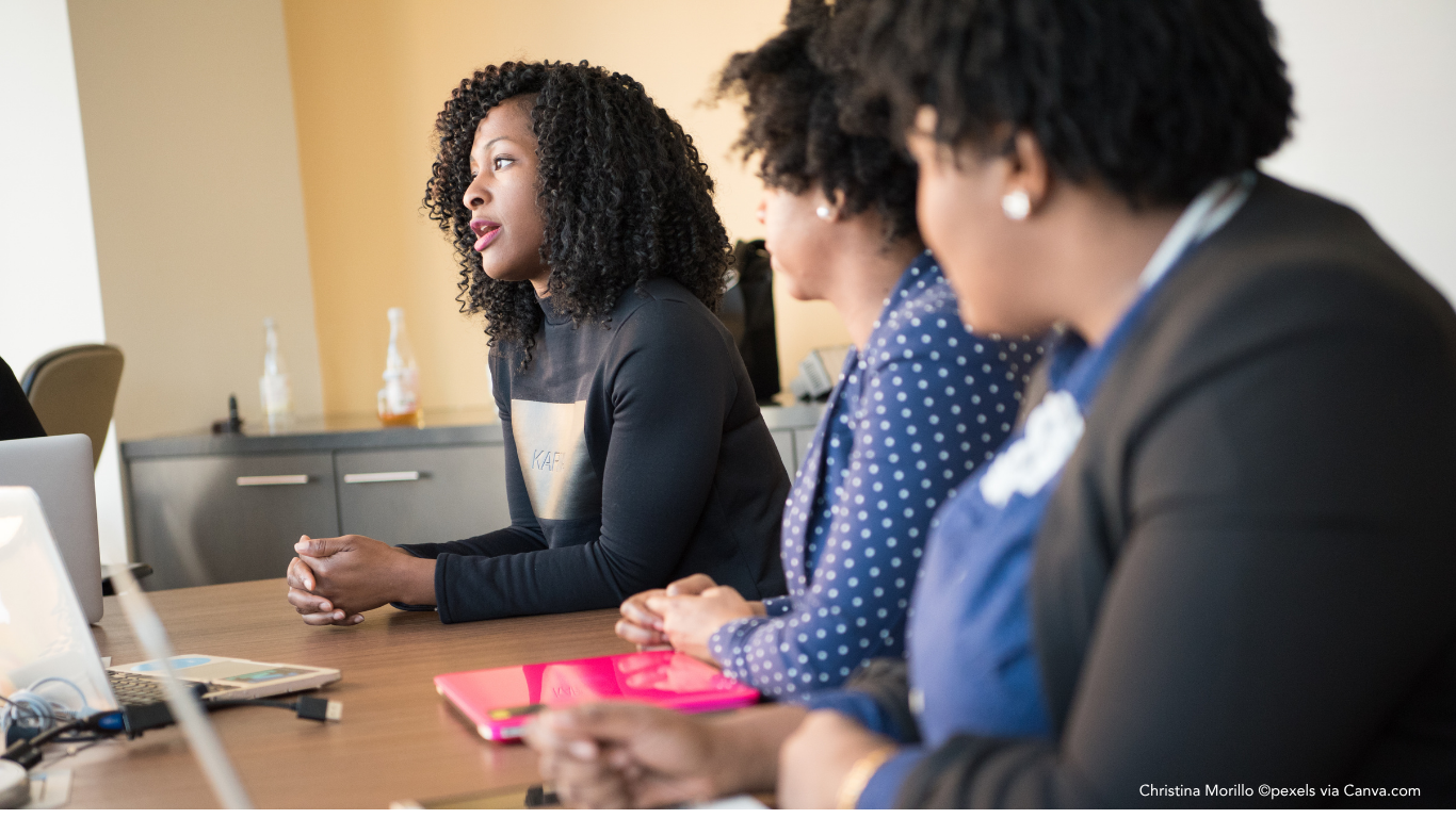 woman speaking up at meeting The Introvert’s Guide to Visibility at Work